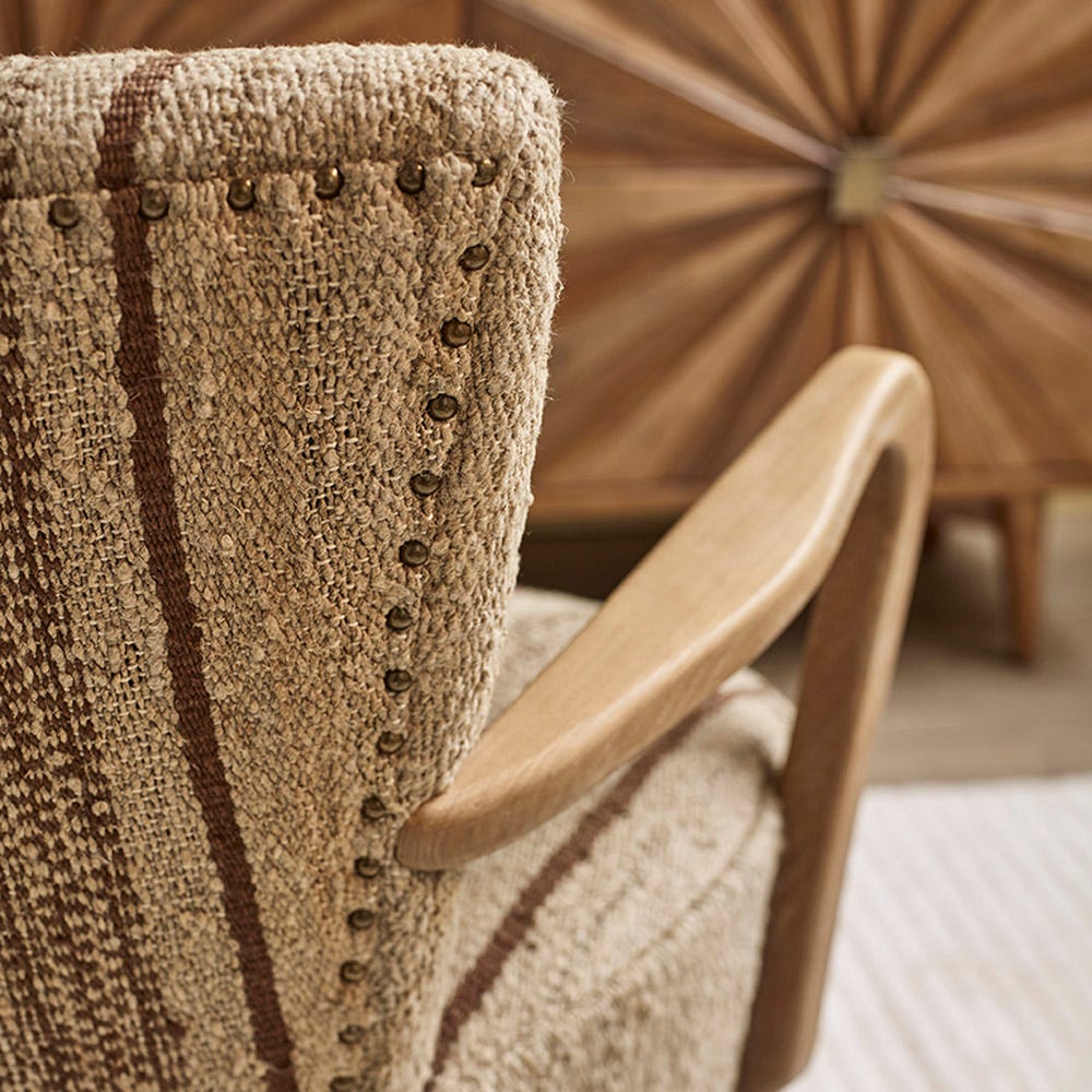CALVIN IN BROWN STRIPED RUG