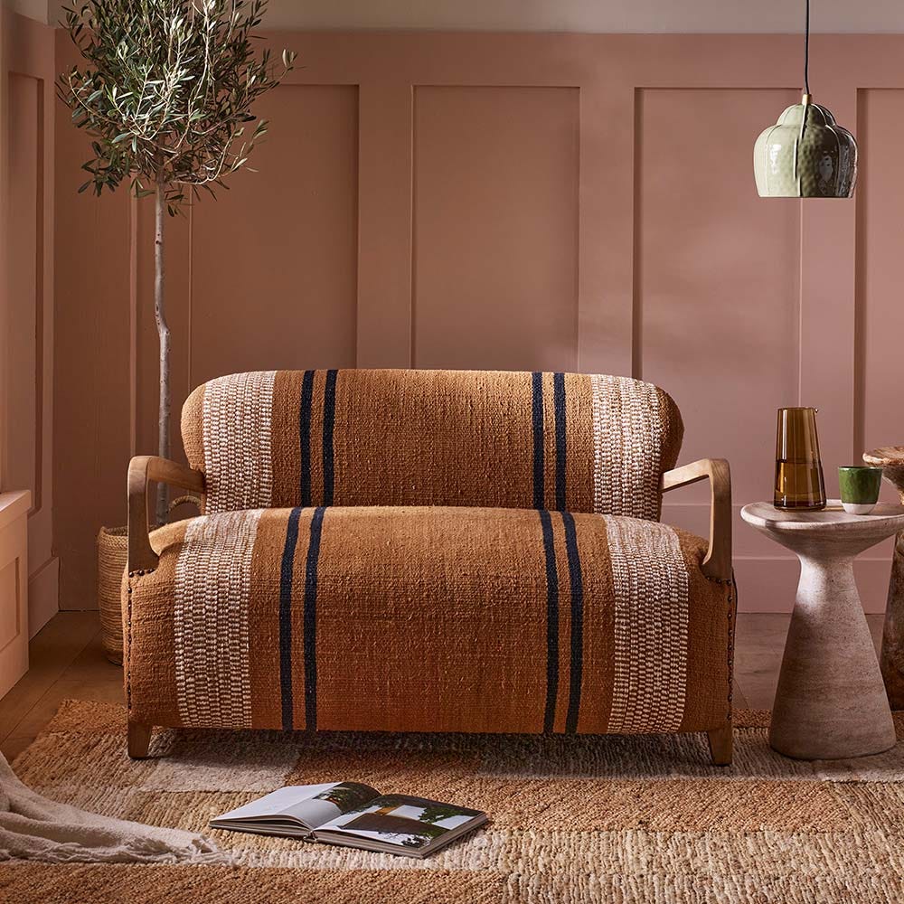 AVIATOR LOVESEAT IN STRIPED RUG