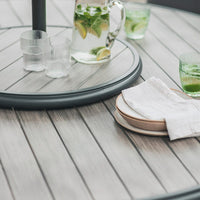 Gabriela 6 Seat Dining Set with Lazy Susan and Parasol